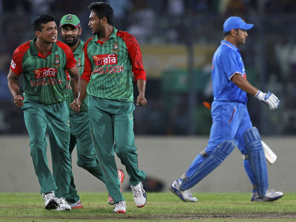 Dhoni (right) leaves the filed after being dismissed during 1st ODI Dhoni (right) leaves the filed after being dismissed during 1st ODI