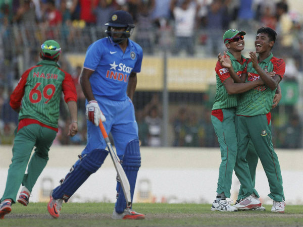 Mustafizur Rahman, right, celebrates with his teammate Taskin Ahmed, second right, after the dismissal of R Ashwin, second left Mustafizur Rahman, right, celebrates with his teammate Taskin Ahmed, second right, after the dismissal of R Ashwin, second left
