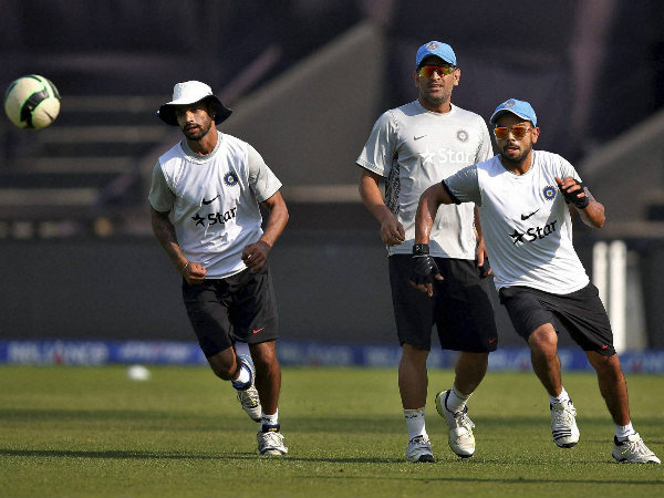 Dhoni (centre) and Kohli (right) play football with Shikhar Dhawan during Team India's training session Dhoni (centre) and Kohli (right) play football with Shikhar Dhawan during Team India's training session