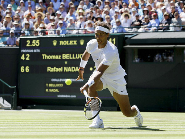 Rafael Nadal of Spain returns a ball to Thomaz Bellucci of Brazil Rafael Nadal of Spain returns a ball to Thomaz Bellucci of Brazil
