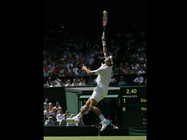 Roger Federer of Switzerland smashes a ball to Damir Dzumhur of Bosnia Roger Federer of Switzerland smashes a ball to Damir Dzumhur of Bosnia
