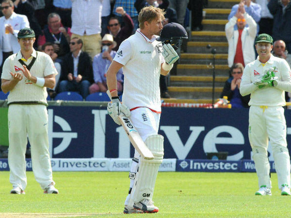 Joe Root kisses the badge on his helmet as he celebrates a century applauded by Brad Haddin, left, and Shane Watson, right, during day one of the first Ashes Test Joe Root kisses the badge on his helmet as he celebrates a century applauded by Brad Haddin, left, and Shane Watson, right, during day one of the first Ashes Test