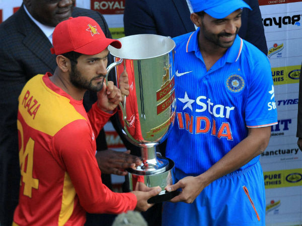 Raza (left) and Ajinkya Rahane pose with the trophy Raza (left) and Ajinkya Rahane pose with the trophy