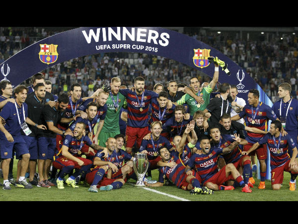 Barcelona players celebrate with the trophy after winning the UEFA Super Cup Barcelona players celebrate with the trophy after winning the UEFA Super Cup