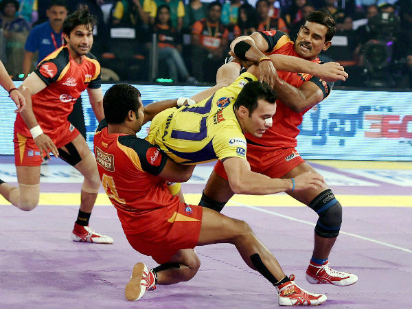 Players in action during the semi-final between Telugu Titans (yellow) and Bengaluru Bulls (Red) in Mumbai on Friday. Players in action during the semi-final between Telugu Titans (yellow) and Bengaluru Bulls (Red) in Mumbai on Friday.