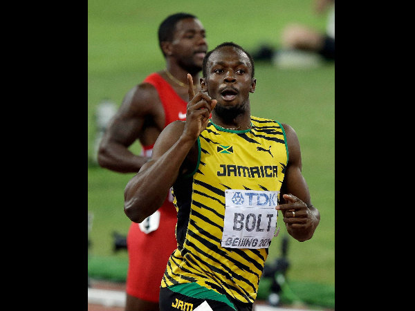 Bolt celebrates after winning the gold in the men's 200m final Bolt celebrates after winning the gold in the men's 200m final