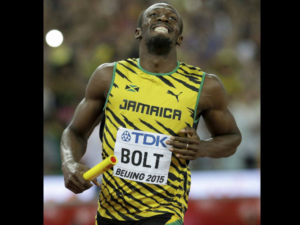 Usain Bolt smiles after anchoring their men's 4x100m relay team to victory Usain Bolt smiles after anchoring their men's 4x100m relay team to victory