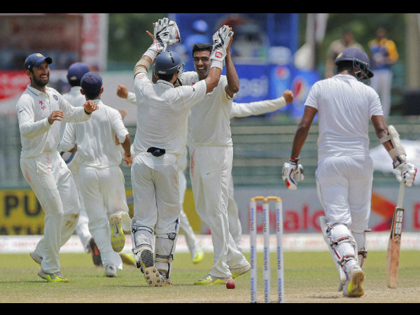 Ashwin, centre, face to camera celebrates the wicket of Thirimanne, right, with team-mates on the final day Ashwin, centre, face to camera celebrates the wicket of Thirimanne, right, with team-mates on the final day