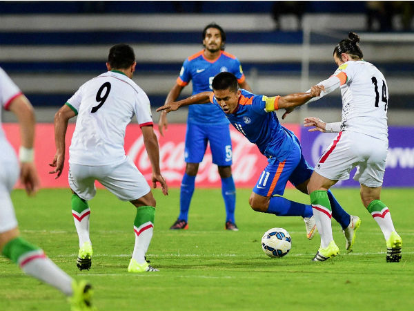 India's captain Sunil Chettri (Blue) vies for possession of the ball with Andranik Teymourian of Iran India's captain Sunil Chettri (Blue) vies for possession of the ball with Andranik Teymourian of Iran