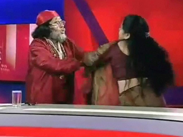 Omji Maharaj and Sadhvi Deepa fight during a debate at a news channel. Omji Maharaj and Sadhvi Deepa fight during a debate at a news channel.