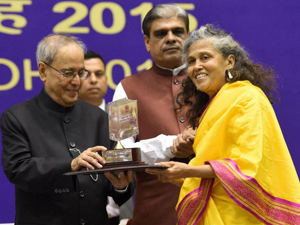 President Pranab Mukherjee presenting the Rajbhasa awards as MoS for Home Affairs, Haribhai Choudhary looks on during Hindi Divas 2015 function in New Delhi. President Pranab Mukherjee presenting the Rajbhasa awards as MoS for Home Affairs, Haribhai Choudhary looks on during Hindi Divas 2015 function in New Delhi.