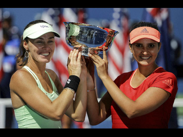 Martina (left) and Sania pose with their US Open trophy Martina (left) and Sania pose with their US Open trophy