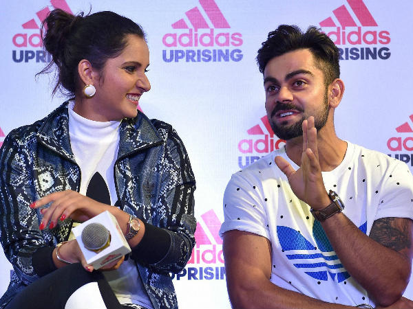 Virat Kohli (right) and Sania Mirza share a light moment during the launch of Adidas showroom in Bengaluru on Saturday. Virat Kohli (right) and Sania Mirza share a light moment during the launch of Adidas showroom in Bengaluru on Saturday.