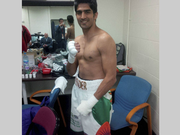 Vijender Singh poses for pictures before his bout Vijender Singh poses for pictures before his bout