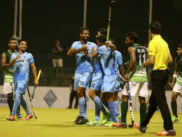 Indian players (blue) celebrate after scoring a goal against Pakistan Indian players (blue) celebrate after scoring a goal against Pakistan