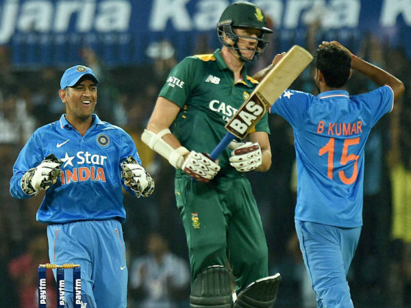 Dhoni (left) and Bhuvneshwar (right) celebrate the dismissal of Morne Morkel (centre), South Africa's last wicket, in Indore Dhoni (left) and Bhuvneshwar (right) celebrate the dismissal of Morne Morkel (centre), South Africa's last wicket, in Indore
