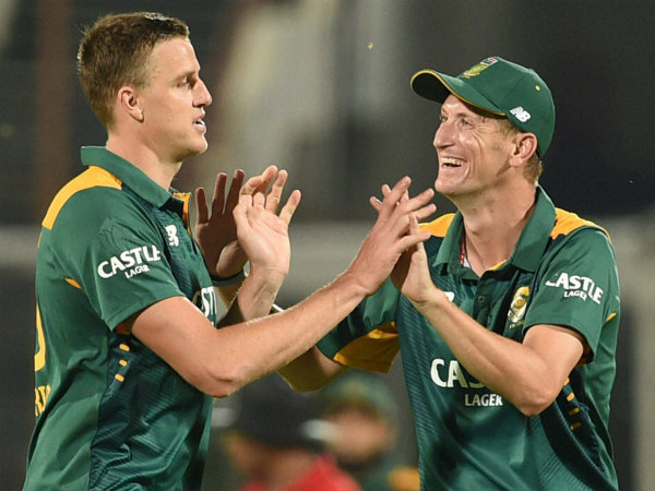 Morkel (right) celebrates with substitute fielder Chris Morris after sending back Kohli Morkel (right) celebrates with substitute fielder Chris Morris after sending back Kohli