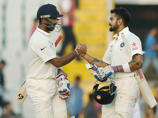 Pujara (left) and Kohli during their partnership Pujara (left) and Kohli during their partnership