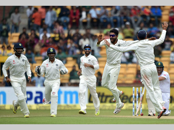 Ravindra Jadeja, with team-mates, celebrates the wicket of Dean Elgar Ravindra Jadeja, with team-mates, celebrates the wicket of Dean Elgar