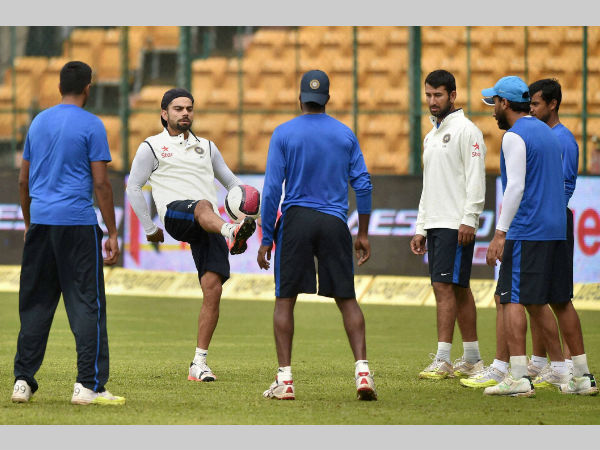 Virat Kohli kicks a ball as he plays football with team-mated during a rain break in Bengaluru Virat Kohli kicks a ball as he plays football with team-mated during a rain break in Bengaluru
