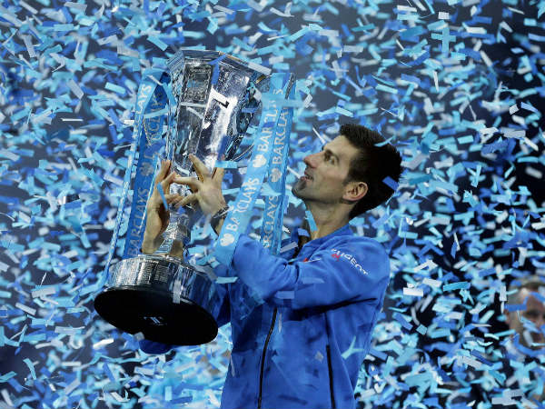 Novak Djokovic holds up his trophy after defeating Roger Federer Novak Djokovic holds up his trophy after defeating Roger Federer