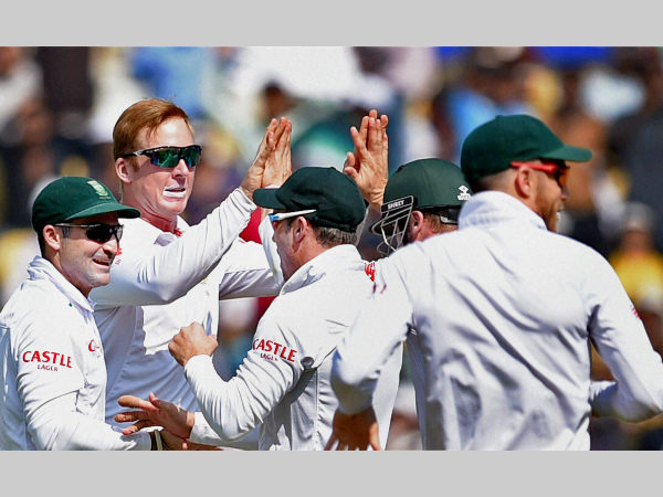 Harmer (second left) celebrates with team-mates after dismissing Pujara Harmer (second left) celebrates with team-mates after dismissing Pujara