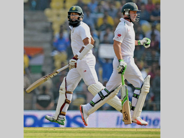 Amla (left) and De Villiers run between the wickets Amla (left) and De Villiers run between the wickets