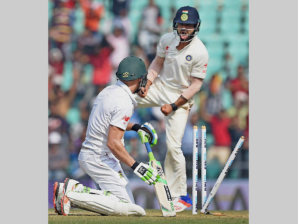 Kohli (right) is ecstatic after Du Plessis (left) is bowled by Mishra (not pictured) Kohli (right) is ecstatic after Du Plessis (left) is bowled by Mishra (not pictured)