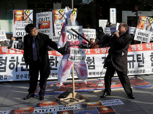 A South Korean protester with a wooden stick beats an effigy of North Korean leader Kim Jong Un during a rally against North Korea's announcement that it had tested a hydrogen bomb, in Seoul, South Korea, Thursday, Jan. 7, 2016. The United States, South Korea and Japan agreed to launch a “united and strong” international response to North Korea’s apparent fourth nuclear test, as experts scrambled Thursday to find more details about the detonation that drew worldwide skepticism and condemnation. A South Korean protester with a wooden stick beats an effigy of North Korean leader Kim Jong Un during a rally against North Korea's announcement that it had tested a hydrogen bomb, in Seoul, South Korea, Thursday, Jan. 7, 2016. The United States, South Korea and Japan agreed to launch a “united and strong” international response to North Korea’s apparent fourth nuclear test, as experts scrambled Thursday to find more details about the detonation that drew worldwide skepticism and condemnation.