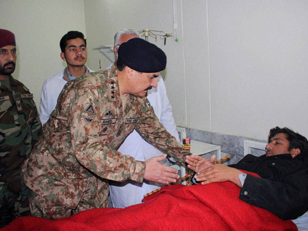 Pakistan's army chief Raheel Sharif talks to a man injured in an attack on a university, at a local hospital in Charsadda town, some 35 kilometers (21 miles) outside the city of Peshawar, Pakistan, Wednesday, Jan. 20, 2016. Gunmen stormed Bacha Khan University named after the founder of an anti-Taliban political party in the country's northwest Wednesday, killing many people, officials said. Pakistan's army chief Raheel Sharif talks to a man injured in an attack on a university, at a local hospital in Charsadda town, some 35 kilometers (21 miles) outside the city of Peshawar, Pakistan, Wednesday, Jan. 20, 2016. Gunmen stormed Bacha Khan University named after the founder of an anti-Taliban political party in the country's northwest Wednesday, killing many people, officials said.