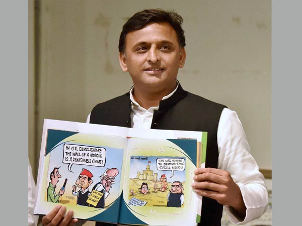 Uttar Pradesh Chief Minister Akhilesh Yadav releases a book "Tipu ka Afsana" based on cartoons on him at Samajwadi Party headquarters in Lucknow on Monday. Uttar Pradesh Chief Minister Akhilesh Yadav releases a book "Tipu ka Afsana" based on cartoons on him at Samajwadi Party headquarters in Lucknow on Monday.