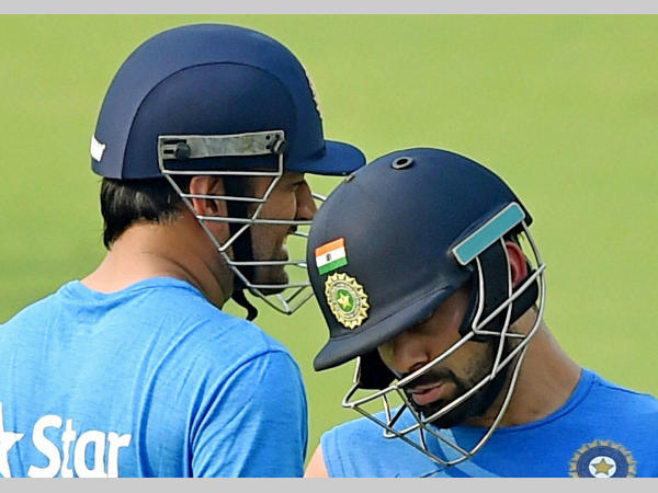 Dhoni (left) and Kohli at practice during World T20 Dhoni (left) and Kohli at practice during World T20