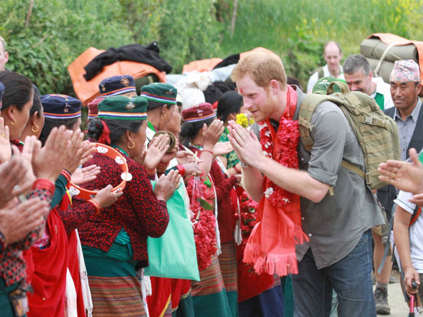 In this handout photo provided by National News Agency of Nepal, Britain’s Prince Harry is welcomed by the villagers upon his arrival in Lamjung, Nepal, Monday, March 21 In this handout photo provided by National News Agency of Nepal, Britain’s Prince Harry is welcomed by the villagers upon his arrival in Lamjung, Nepal, Monday, March 21