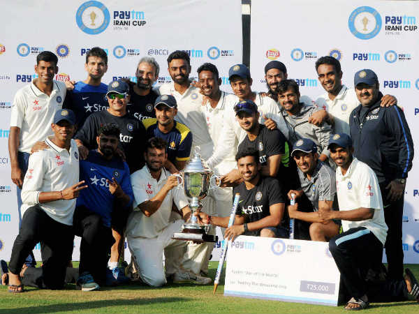 Rest of India players and support staff celebrate with the trophy Rest of India players and support staff celebrate with the trophy
