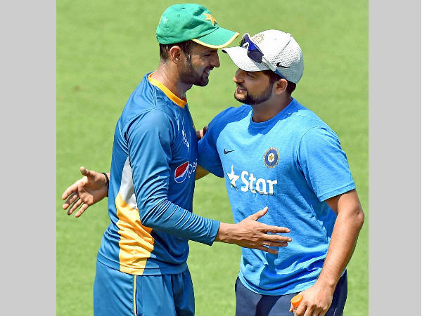 Raina (right) and Malik greet each other during practice at Eden Gardens Raina (right) and Malik greet each other during practice at Eden Gardens