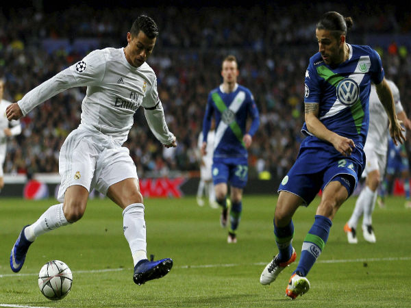 Cristiano Ronaldo fights for the ball against Wolfsburg's Ricardo Rodriguez during the Champions League 2nd leg quarterfinal soccer match between Real Madrid and VfL Wolfsburg. Cristiano Ronaldo fights for the ball against Wolfsburg's Ricardo Rodriguez during the Champions League 2nd leg quarterfinal soccer match between Real Madrid and VfL Wolfsburg.