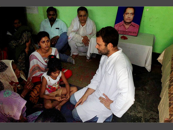 Congress Vice President Rahul Gandhi meeting a family during a visit to his constituency Amethi on Thursday. Congress Vice President Rahul Gandhi meeting a family during a visit to his constituency Amethi on Thursday.