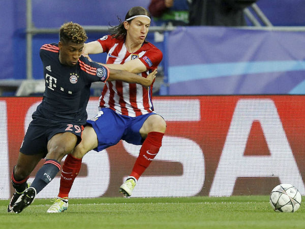 Atletico's Filipe Luis, right, and Bayern’s Kingsley Coman challenge for the ball during the Champions League 1st leg semifinal soccer match between Atletico Madrid and Bayern Munich at the Vicente Calderon stadium in Madrid Atletico's Filipe Luis, right, and Bayern’s Kingsley Coman challenge for the ball during the Champions League 1st leg semifinal soccer match between Atletico Madrid and Bayern Munich at the Vicente Calderon stadium in Madrid