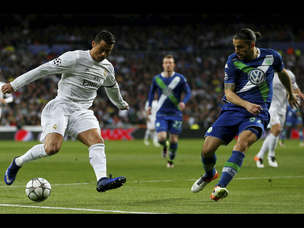 Real Madrid's Cristiano Ronaldo fights for the ball against Wolfsburg's Ricardo Rodriguez during the Champions League 2nd leg quarterfinal soccer match between Real Madrid and VfL Wolfsburg Real Madrid's Cristiano Ronaldo fights for the ball against Wolfsburg's Ricardo Rodriguez during the Champions League 2nd leg quarterfinal soccer match between Real Madrid and VfL Wolfsburg