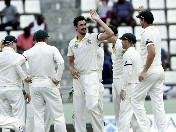 Australia's bowler Mitchell Starc, center, high fives with teammates after bowling out West Indies' batsman Kraigg Brathwaite, for 15 runs, during the second innings on the day two of their first cricket Test match in Roseau, Dominica, June 4, 2015. Australia's bowler Mitchell Starc, center, high fives with teammates after bowling out West Indies' batsman Kraigg Brathwaite, for 15 runs, during the second innings on the day two of their first cricket Test match in Roseau, Dominica, June 4, 2015.