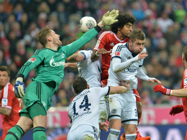 Bayern's Dante of Brazil, center, Schalke's Jermaine Jones of the U.S., left, and Roman Neustaedter in a goal mouth melee during the German first division Bundesliga soccer match between FC Bayern Munich and FC Schalke in Munich, Germany March 1. 2014. Bayern's Dante of Brazil, center, Schalke's Jermaine Jones of the U.S., left, and Roman Neustaedter in a goal mouth melee during the German first division Bundesliga soccer match between FC Bayern Munich and FC Schalke in Munich, Germany March 1. 2014.
