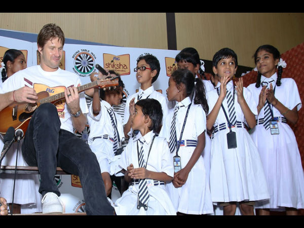 Shiksha Superhero Shane Watson along with the P&G Shiksha students strumming his favorite song Shiksha Superhero Shane Watson along with the P&G Shiksha students strumming his favorite song