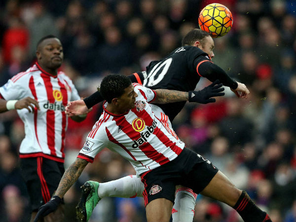 Sunderland's Patrick Van Aanholt, front, vies for the ball with Manchester United's captain Wayne Rooney during English Premier League. Sunderland's Patrick Van Aanholt, front, vies for the ball with Manchester United's captain Wayne Rooney during English Premier League.