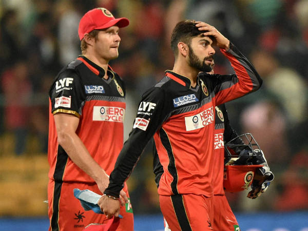 File photo: Virat Kohli (right) is one over rate offence away from suspension. Also seen is team-mate Shane Watson File photo: Virat Kohli (right) is one over rate offence away from suspension. Also seen is team-mate Shane Watson