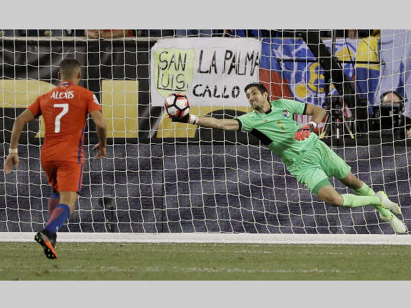 Panama's Jaime Penedo, right, dives to block a shot by Chile's Alexis Sanchez during the second half of their Copa America Group D match Panama's Jaime Penedo, right, dives to block a shot by Chile's Alexis Sanchez during the second half of their Copa America Group D match