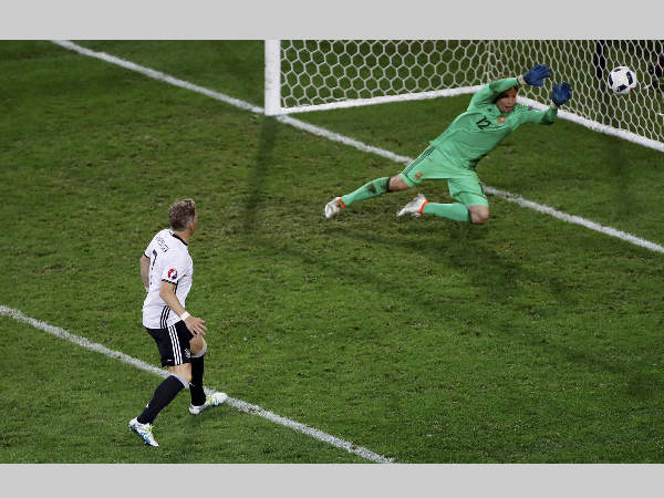 Germany's Bastian Schweinsteiger, left, scores his side's second goal past Ukraine goalkeeper Andriy Pyatov during Euro 2016 Germany's Bastian Schweinsteiger, left, scores his side's second goal past Ukraine goalkeeper Andriy Pyatov during Euro 2016