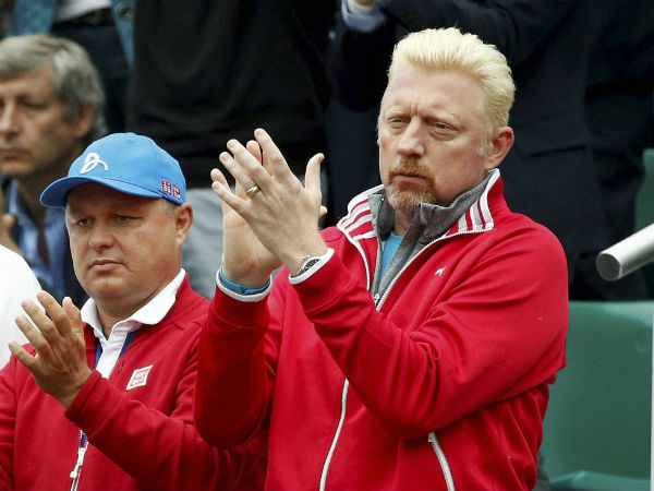 Former German tennis champion Boris Becker applauds as Serbia's Novak Djokovic plays Britain's Andy Murray during their final match of the French Open Former German tennis champion Boris Becker applauds as Serbia's Novak Djokovic plays Britain's Andy Murray during their final match of the French Open