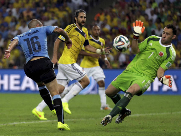 File photo: Colombia's goalkeeper David Ospina (right) makes a save from Uruguay's Maxi Pereira during the World Cup round of 16 soccer match in 2014 File photo: Colombia's goalkeeper David Ospina (right) makes a save from Uruguay's Maxi Pereira during the World Cup round of 16 soccer match in 2014