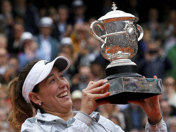 Spain's Garbine Muguruza holds the cup after defeating Serena Williams of the U.S. after their final match of the French Open tennis tournament at the Roland Garros stadium, Saturday, June 4. Spain's Garbine Muguruza holds the cup after defeating Serena Williams of the U.S. after their final match of the French Open tennis tournament at the Roland Garros stadium, Saturday, June 4.