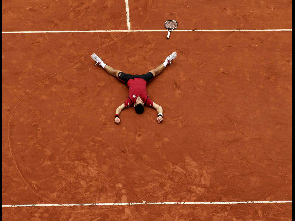 Serbia's Novak Djokovic lays on the clay in a heart in drew after defeating Britain's Andy Murray during their final match of the French Open tennis tournament at the Roland Garros. Serbia's Novak Djokovic lays on the clay in a heart in drew after defeating Britain's Andy Murray during their final match of the French Open tennis tournament at the Roland Garros.